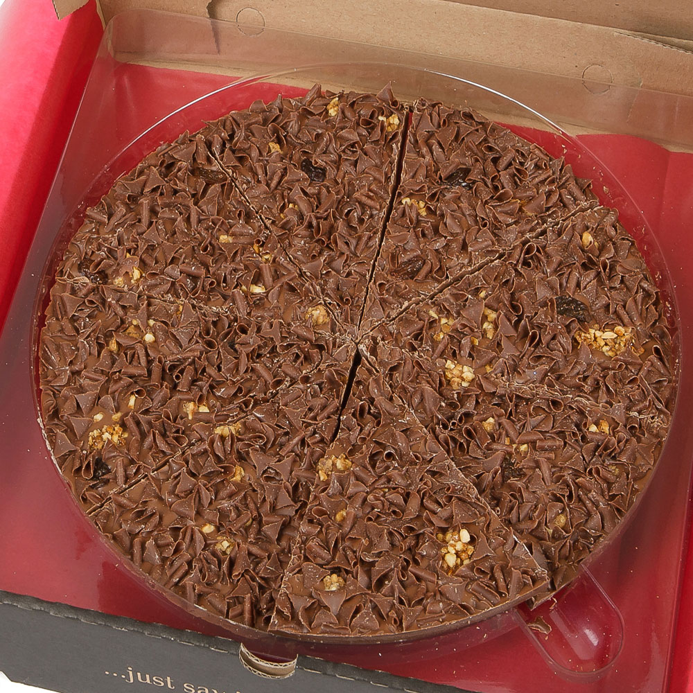 Belgian chocolate pizza topped with caramelised hazelnuts, raisins and milk chocolate curls